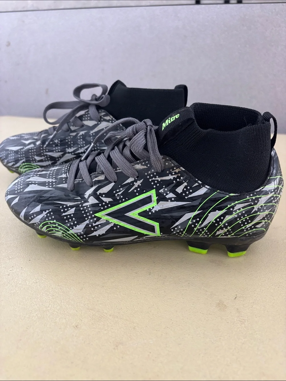 Kids' Black Soccer Cleats with Neon Green Accents